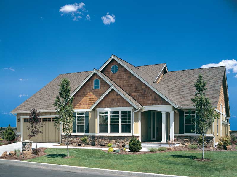 Overlapping Gables And Its Rustic Design Make This Craftsman Home 