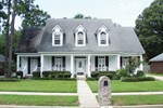 Southern Country Style Home With Three Dormers And Covered Front Porch
