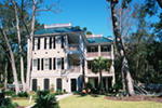 Raised Southern Plantation Home With Multiple Level Wrap-Around Porches