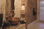 Tuscan inspired powder room with stucco walls, artistic bowl-style sink and faux painted walls.