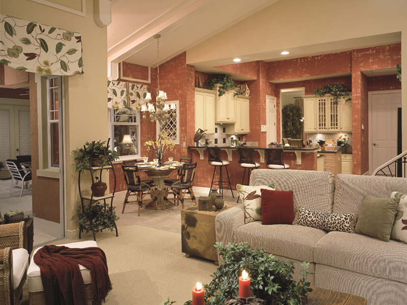 Open Florida house plan combines the family room and kitchen.